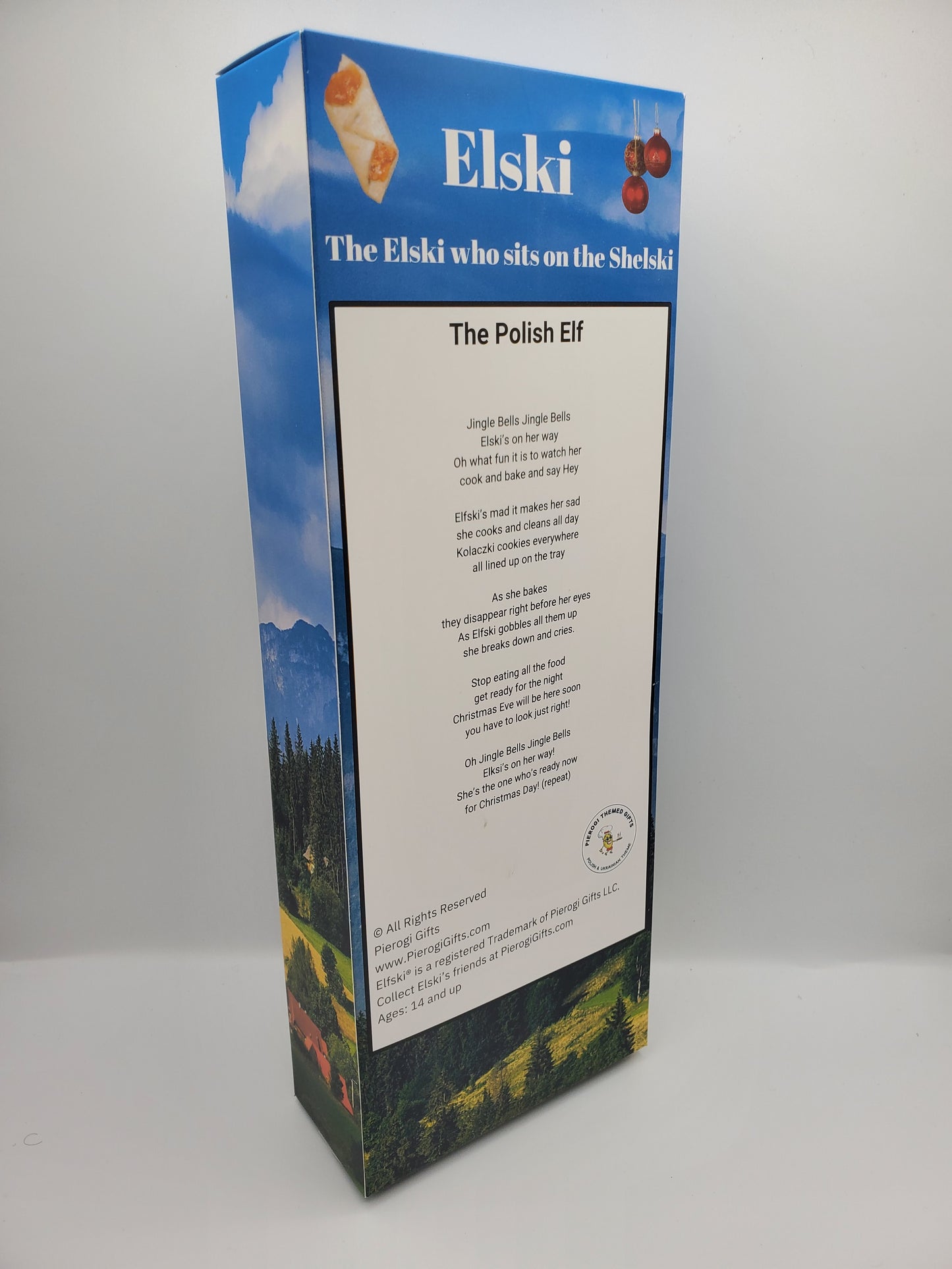 Pierogi Gifts Elfski and Elski Polish Elves collectible doll packaging with blue sky and landscape design