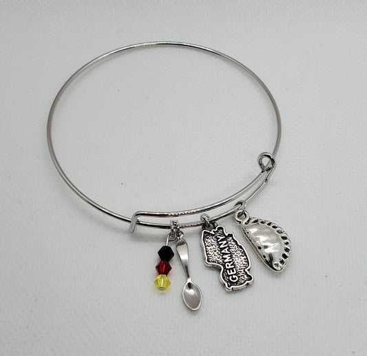 Silver German charm bracelet pierogi with map, spoon, pierogi, and colorful beads charms