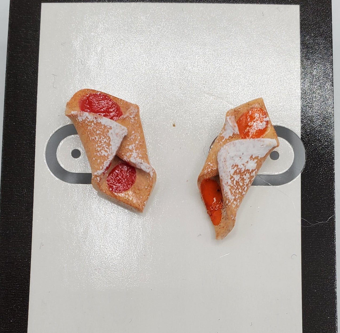 Pierogi Gifts kolache shaped earrings with powdered sugar and fruit filling details on white card