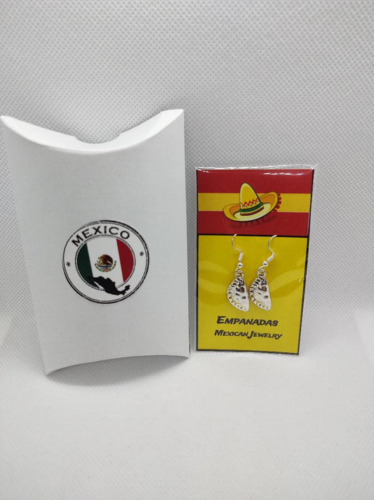 Mexican empanada earrings displayed on colorful card with sombrero design and Mexico flag packaging
