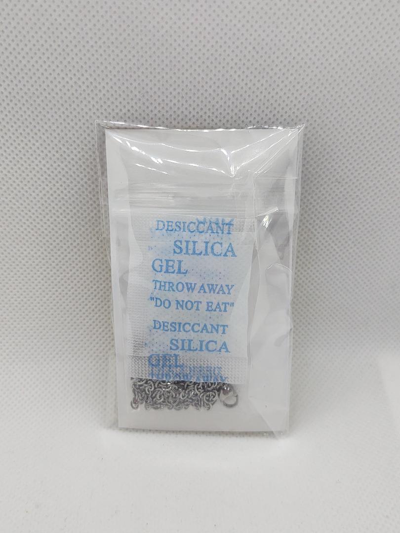 Romanian necklace stainless steel with intricate chain design packaged with silica gel desiccant