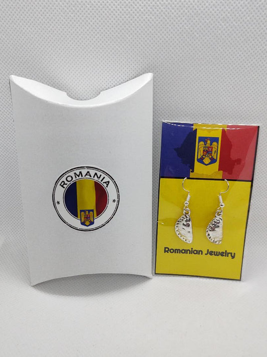 Romanian pierogi earrings displayed on colorful card with Romania flag and emblem
