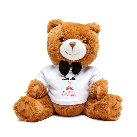 Brown teddy bear wearing a white shirt with text and a black bow tie on a white background
