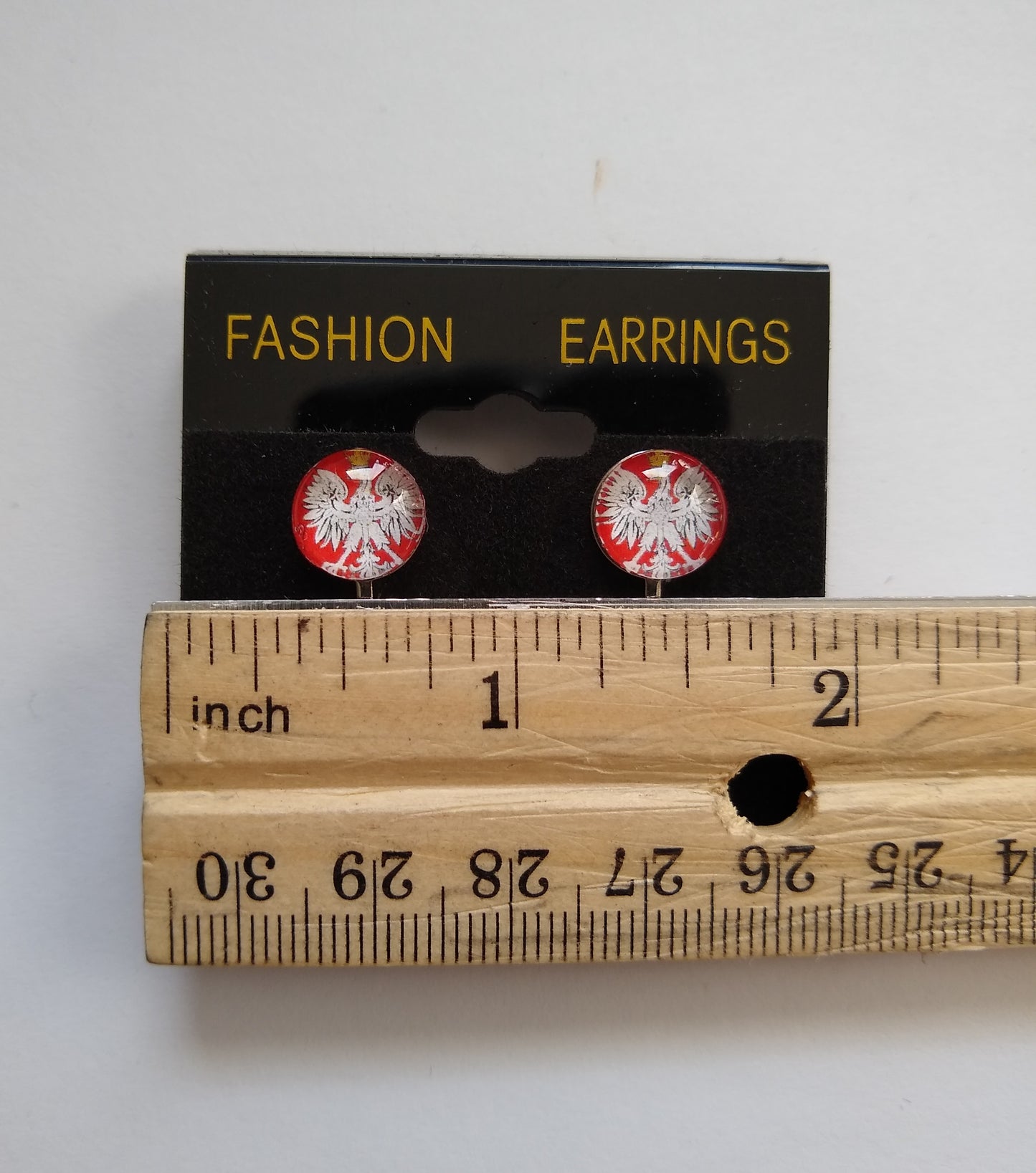 Clip Earrings with Polish Eagle with Crown. 10mm cabachon with a silver colored (not real silver) base. Ruler showing measurement of the cabachon. 